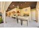 This covered outdoor kitchen has a grill and a bar, perfect for entertaining at 1112 Orange Ave, Winter Springs, FL 32708