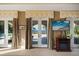 Close up view of french doors to the backyard, views of the water, pool, and a flatscreen tv at 1112 Orange Ave, Winter Springs, FL 32708