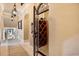 Charming wine cellar with wooden racks and decorative door at 1112 Orange Ave, Winter Springs, FL 32708