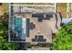 Aerial view of home featuring a screened pool and solar panels on the roof at 1188 Foxforrest Cir, Apopka, FL 32712
