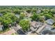 Aerial view showcases this home's solar panels, screened pool, and its position in a leafy neighborhood at 1188 Foxforrest Cir, Apopka, FL 32712