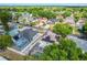 Aerial view of home with a screened pool and a solar panel-covered roof in a treed neighborhood at 1188 Foxforrest Cir, Apopka, FL 32712