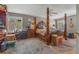Spacious main bedroom featuring natural light, fan, and four poster bed at 1188 Foxforrest Cir, Apopka, FL 32712