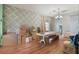 Dining room with wood floors, decorative walls, and moving boxes at 1188 Foxforrest Cir, Apopka, FL 32712