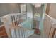 Elevated staircase view overlooking the front door and foyer with chandelier at 1188 Foxforrest Cir, Apopka, FL 32712