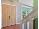 Bright foyer featuring wood floors, a staircase with white banister and colorful walls at 1188 Foxforrest Cir, Apopka, FL 32712