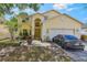 Charming two-story home featuring a well-manicured lawn and attached two-car garage at 1188 Foxforrest Cir, Apopka, FL 32712