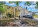 Charming two-story home featuring a well-manicured lawn and attached two-car garage at 1188 Foxforrest Cir, Apopka, FL 32712