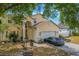 Charming two-story home featuring a well-manicured lawn and attached two-car garage at 1188 Foxforrest Cir, Apopka, FL 32712