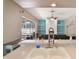 Bright kitchen featuring white countertops, tile backsplash, and open view to the living room and fireplace at 1188 Foxforrest Cir, Apopka, FL 32712