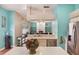 Bright kitchen with a view of the living room, stainless appliances, and breakfast bar at 1188 Foxforrest Cir, Apopka, FL 32712