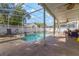 Enjoy the screened pool with ample patio space and privacy fence, perfect for outdoor gatherings at 1188 Foxforrest Cir, Apopka, FL 32712