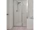Clean and modern shower and tub combination with white tile and updated fixtures at 12188 Ryegrass Trl, Orlando, FL 32824