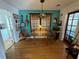 Cozy dining area featuring hardwood floors, turquoise walls, and decorative guitars at 1236 Illinois St, Orlando, FL 32803