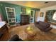 Cozy living room with an area rug, turquoise walls, and built-in white bookshelves at 1236 Illinois St, Orlando, FL 32803