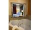 Comfortable bedroom with view to soaking tub, soft lighting, and plush bedding at 12539 Floridays Resort Dr Dr # 208D, Orlando, FL 32821