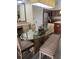Cozy dining area adjacent to kitchen with seating for six, set around a modern glass table at 12539 Floridays Resort Dr Dr # 208D, Orlando, FL 32821