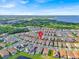 Aerial view of the neighborhood with a lake in the background at 13543 Abberwick Dr, Orlando, FL 32832