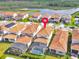 Overhead shot showcasing a home with a screened in pool and beautiful landscaping at 13543 Abberwick Dr, Orlando, FL 32832