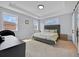Bedroom with carpet flooring, modern gray headboard and two windows at 13543 Abberwick Dr, Orlando, FL 32832