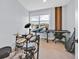 Bright bonus room filled with natural light, features a drum set and a keyboard for musical enjoyment at 13543 Abberwick Dr, Orlando, FL 32832