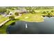 Aerial view of golf course clubhouse with pond and fountain, ideal for leisure and recreation at 13543 Abberwick Dr, Orlando, FL 32832