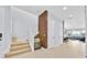 Bright and airy foyer featuring tiled floors, a staircase, and access to the living areas at 13543 Abberwick Dr, Orlando, FL 32832