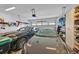 Spacious two car garage with ample storage shelving, offering room for parking and organization at 13543 Abberwick Dr, Orlando, FL 32832