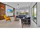 Comfortable living room features stylish shelves, a mounted television, and a plush blue sectional sofa at 13543 Abberwick Dr, Orlando, FL 32832