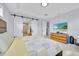 Bedroom with sliding barn doors, ceiling detail, and ensuite bath at 13543 Abberwick Dr, Orlando, FL 32832