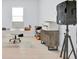 Bright home office with white walls, modern desk and stylish speaker for clear sound at 13543 Abberwick Dr, Orlando, FL 32832
