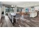 Open-concept dining area with seating for ten, seamlessly connecting to the living room and kitchen at 1449 Fairview Cir, Reunion, FL 34747