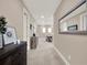 Hallway with wood furnishings leading to the upstairs loft and bedrooms at 1449 Fairview Cir, Reunion, FL 34747