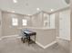 Upstairs loft area with a desk, chair and plenty of natural light at 1449 Fairview Cir, Reunion, FL 34747
