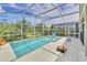 The refreshing private screened-in pool area offers ample outdoor space at 1449 Fairview Cir, Reunion, FL 34747