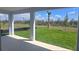 Covered patio overlooking a large, grassy backyard, perfect for outdoor enjoyment at 14599 Crestavista Dr, Clermont, FL 34714
