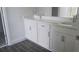 Elegant bathroom vanity featuring double sinks, ample counter space, and modern fixtures at 14599 Crestavista Dr, Clermont, FL 34714