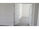 Inviting office space with french doors and plush carpeting, ideal for a quiet workspace at 14599 Crestavista Dr, Clermont, FL 34714