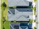 Bird's eye view of rooftops and green yards, displaying the home's position and landscaping at 14749 Walcott Ave, Orlando, FL 32827
