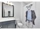 Modern bathroom with fun shower curtain and gray vanity at 14749 Walcott Ave, Orlando, FL 32827