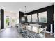 Elegant dining room with a long table, six chairs, and a modern pendant light at 14749 Walcott Ave, Orlando, FL 32827