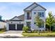 Charming two-story home with a well-kept lawn and inviting curb appeal in a sunny neighborhood at 14749 Walcott Ave, Orlando, FL 32827