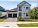Charming two-story home featuring a well-manicured lawn, a 2-car garage, and balcony at 14749 Walcott Ave, Orlando, FL 32827