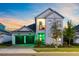 Inviting two-story home with a well-lit two car garage and charming front porch at 14749 Walcott Ave, Orlando, FL 32827