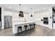 Modern kitchen with stainless steel appliances, large center island with seating, and white cabinetry at 14749 Walcott Ave, Orlando, FL 32827