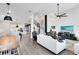 Open concept living room and kitchen features a modern design and seamless flow at 14749 Walcott Ave, Orlando, FL 32827
