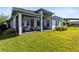 A covered patio with comfortable seating offers a perfect outdoor living space at 14749 Walcott Ave, Orlando, FL 32827