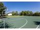 Outdoor basketball court with green surface and hoops, perfect for recreational games and exercise at 14751 Clarkson Dr, Orlando, FL 32828