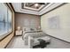 Staged main bedroom features a tray ceiling, large window and neutral color palette with decorative wall art at 14751 Clarkson Dr, Orlando, FL 32828