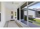 Screened patio showcasing tile floor, ceiling fan and an outdoor living area at 14751 Clarkson Dr, Orlando, FL 32828